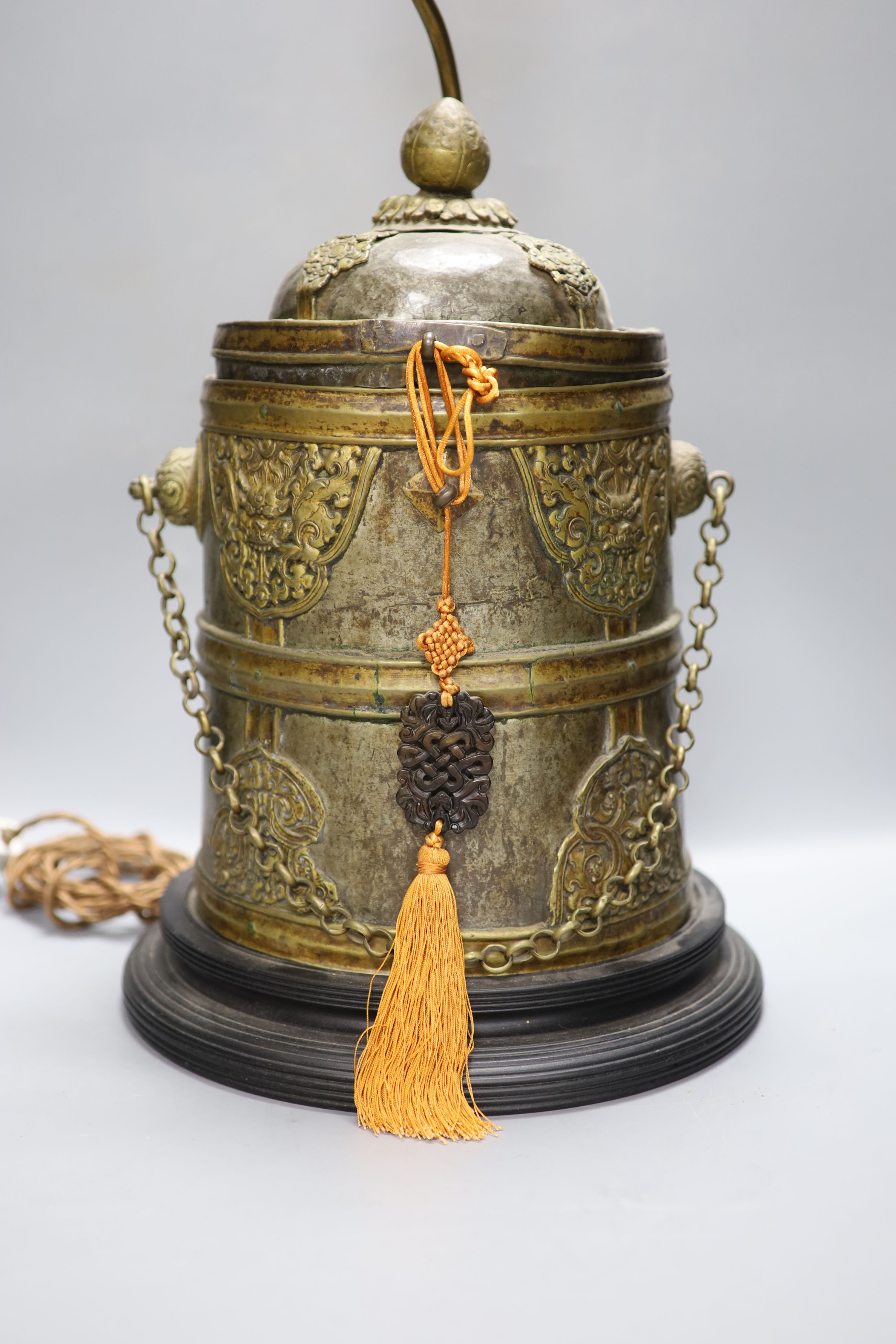 A Tibetan brass box converted lamp base, height 44cm excluding light fittings